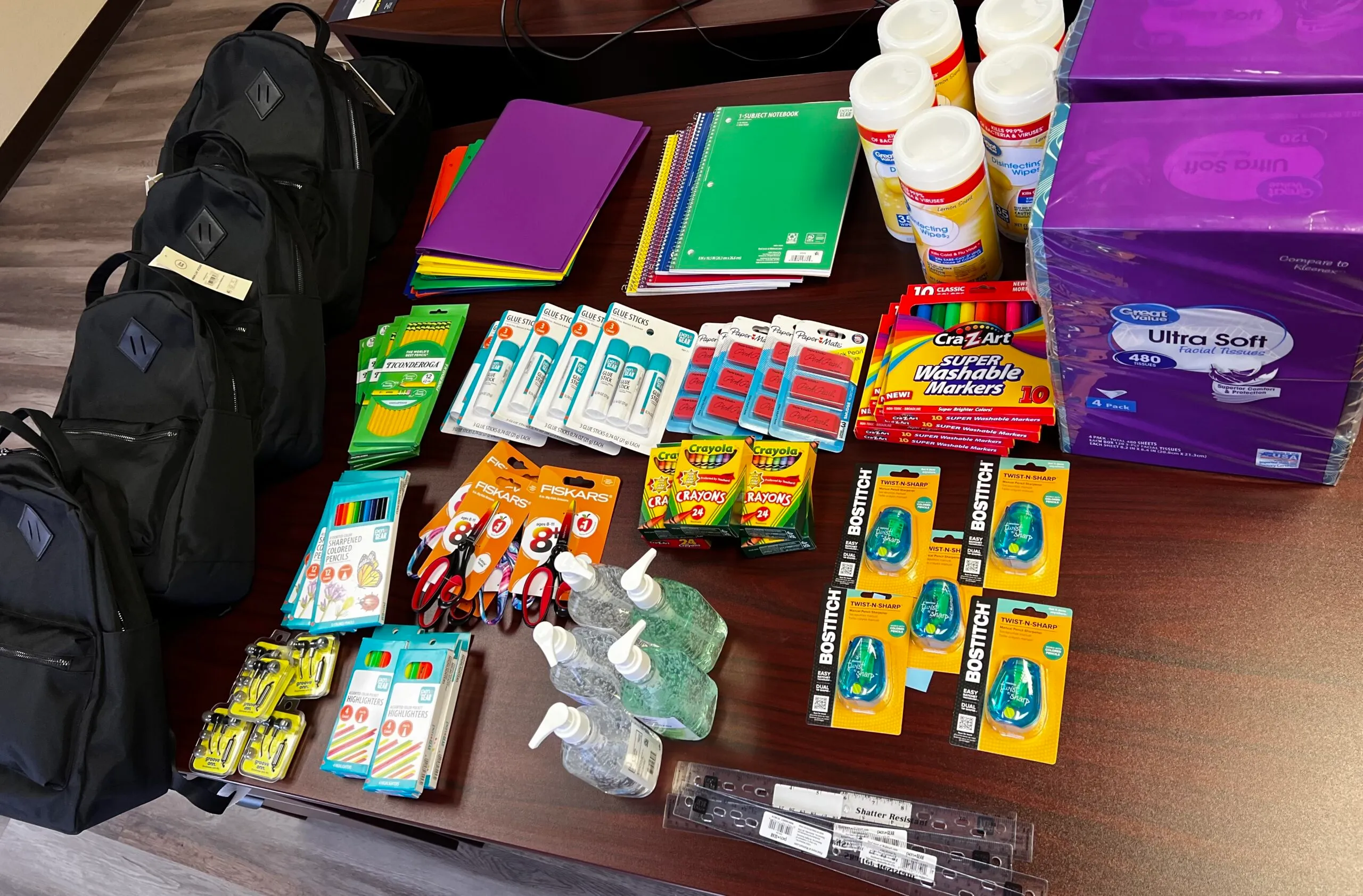 School supplies pictured on AMC's Community Outreach page